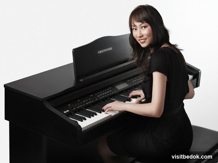 Woman Playing a Digital Piano