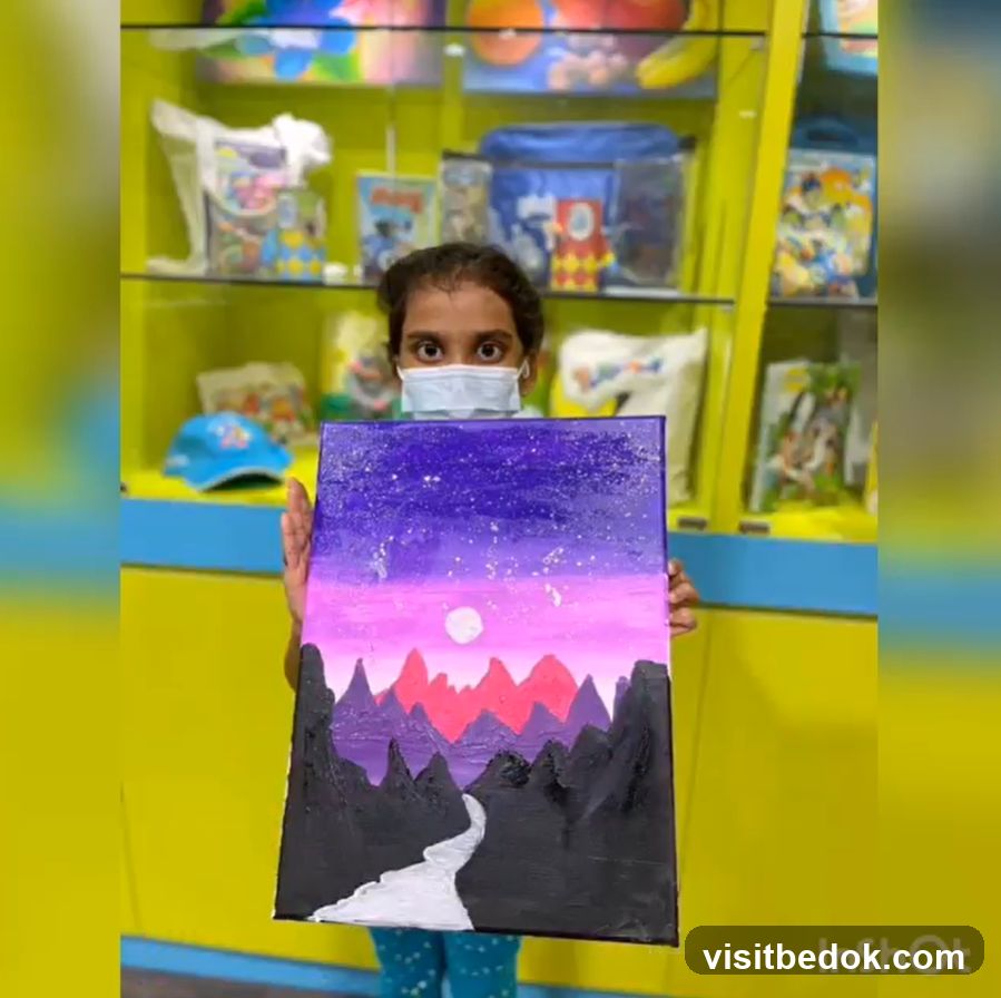 Child holding a painting