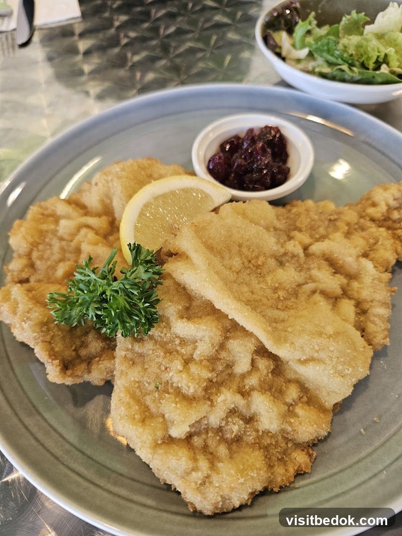 Breaded Cutlets with Cranberry Sauce and Salad