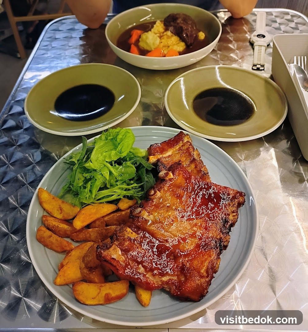 Pork Ribs with Potato Wedges and Salad