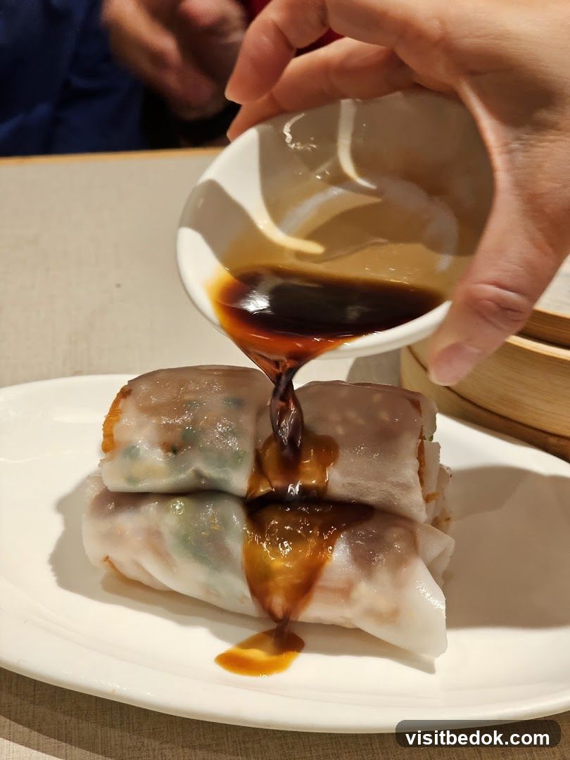 Pouring Sauce on Steamed Rolls