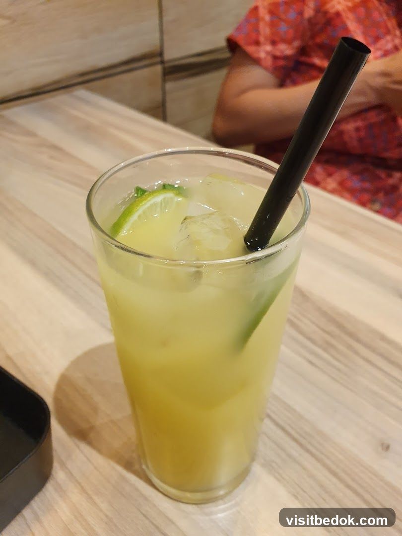 Yellow Drink with Lime and Straw