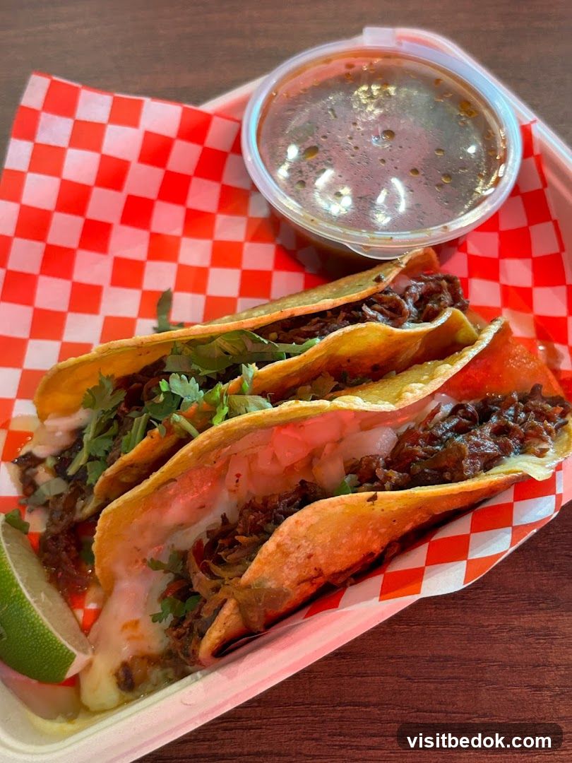 Three Tacos with Dipping Sauce