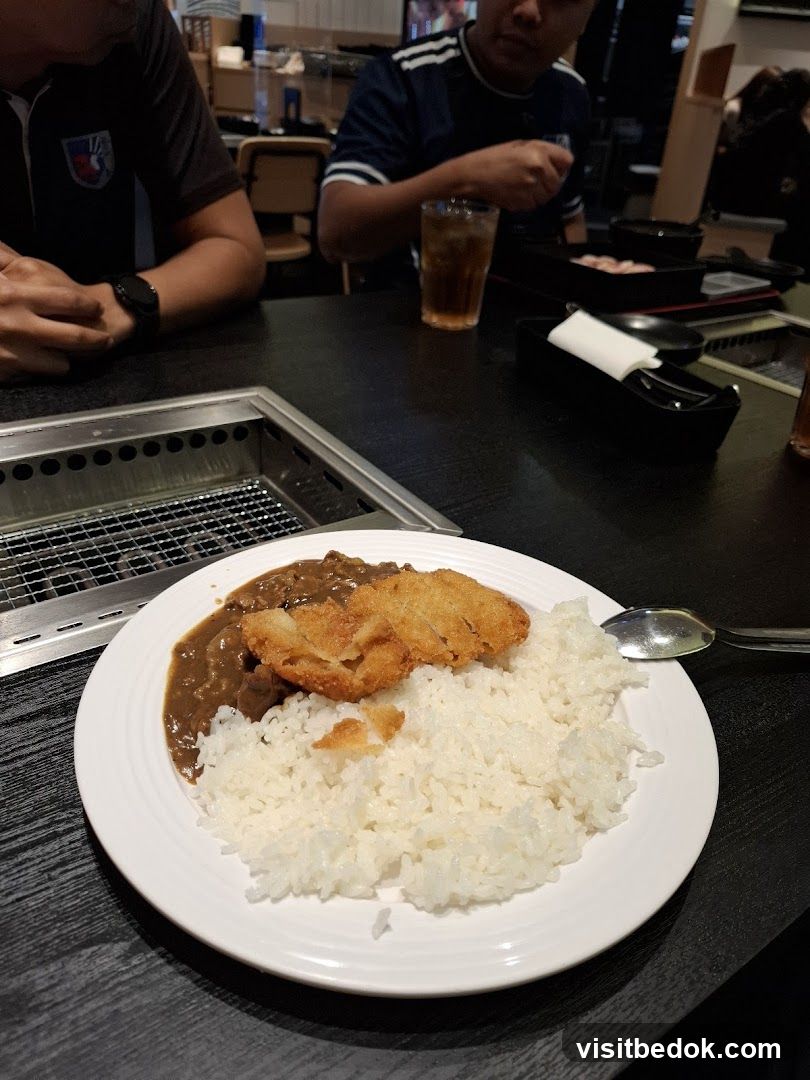 Diners at a Table with Food