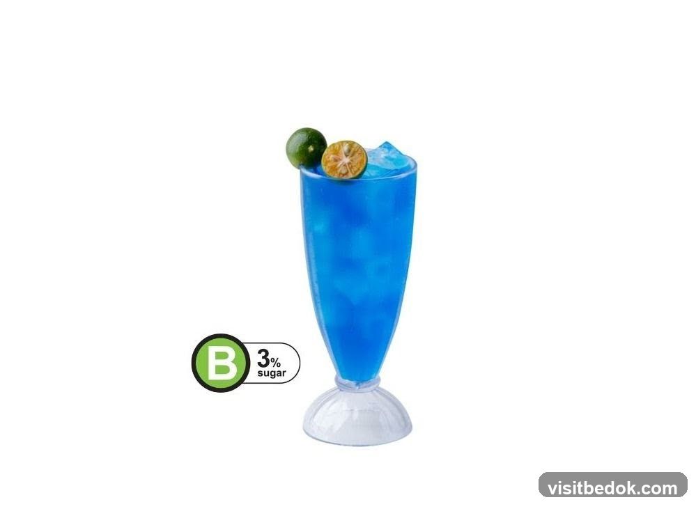Blue Drink with Lime Garnish