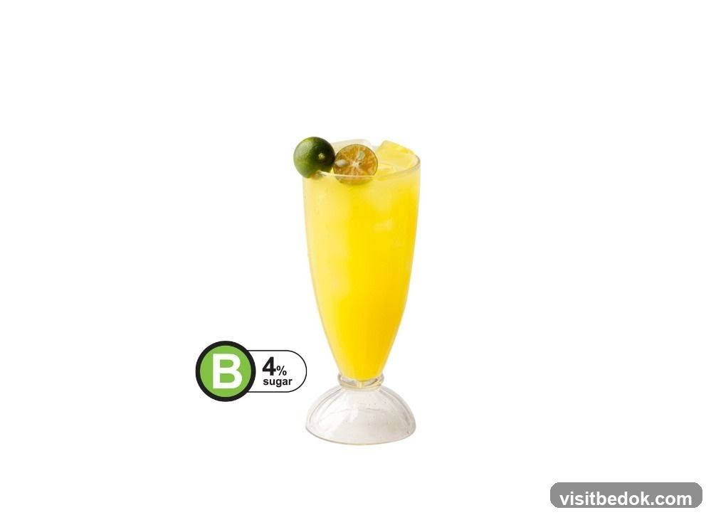 Yellow Drink with Lime Garnish
