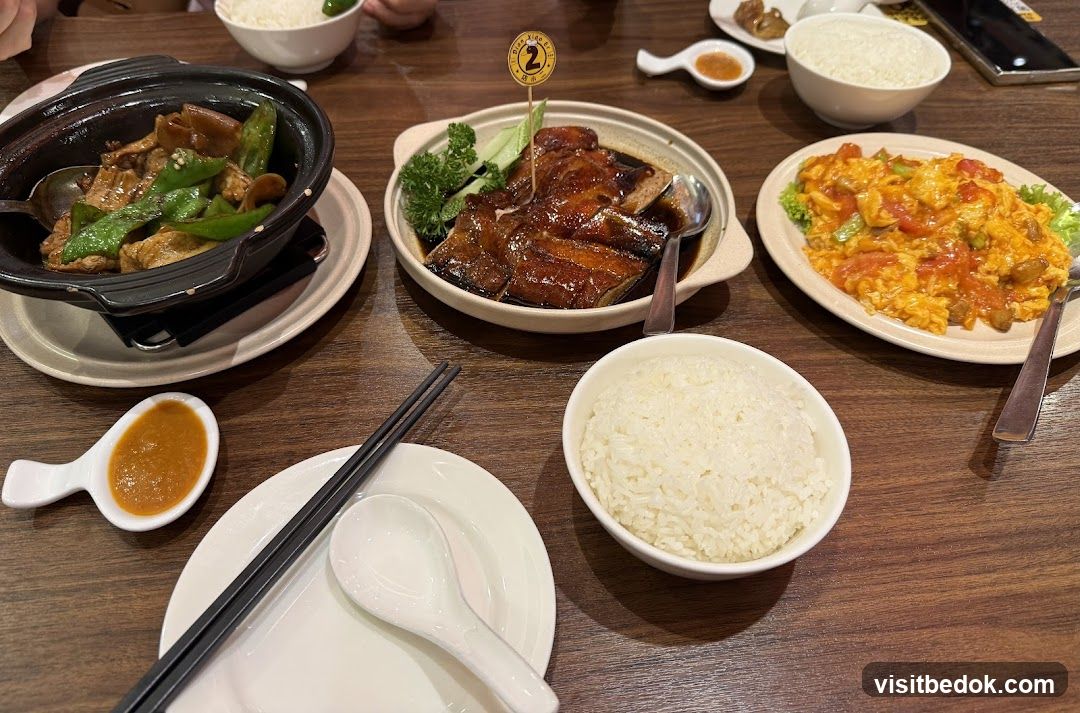 Table with various dishes and rice