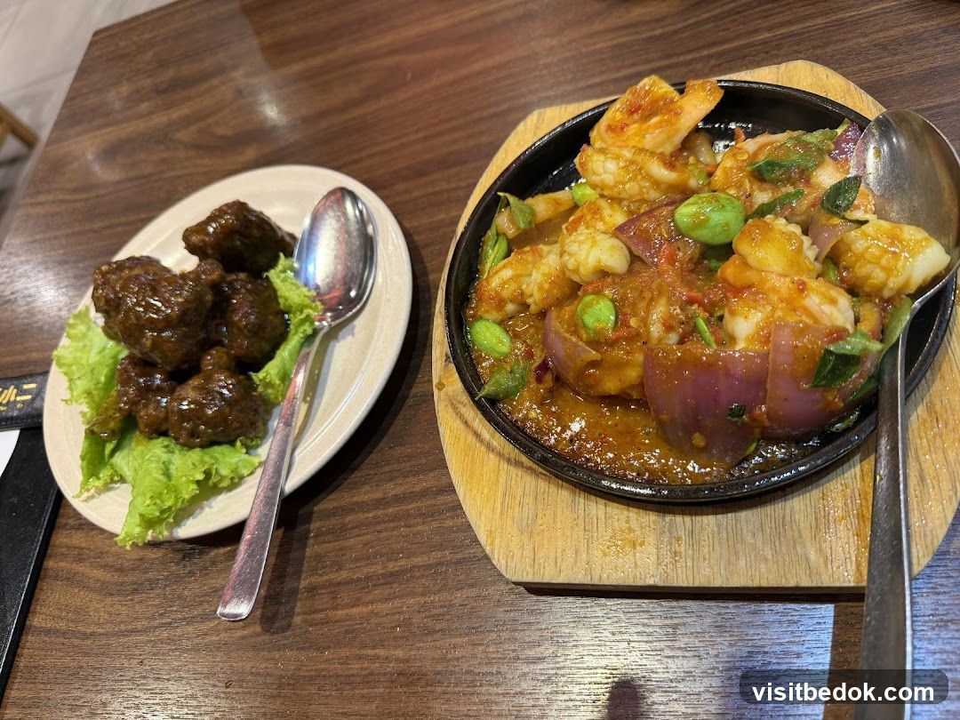Sizzling Seafood and Meatballs