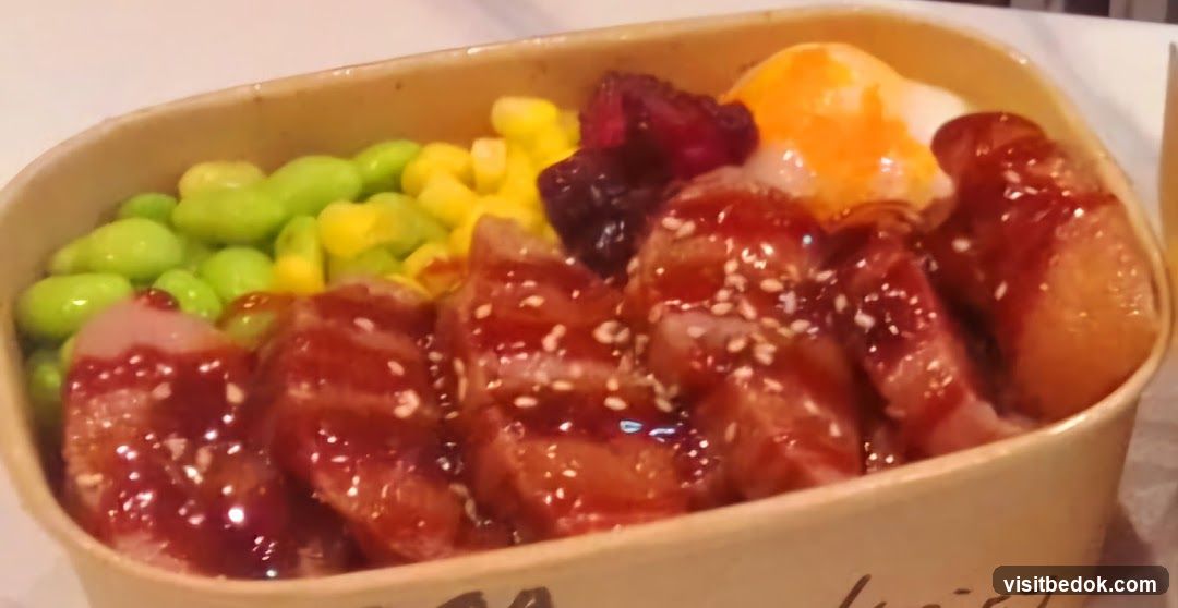 Bento Box with Sliced Meat and Vegetables