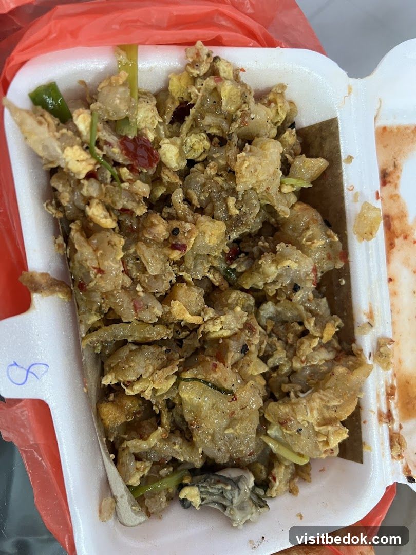 Oyster omelet in a takeout container