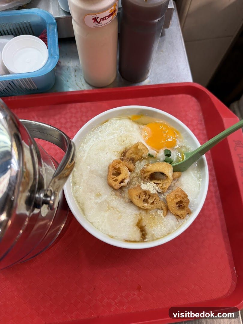 Congee with Egg and Fried Dough Sticks