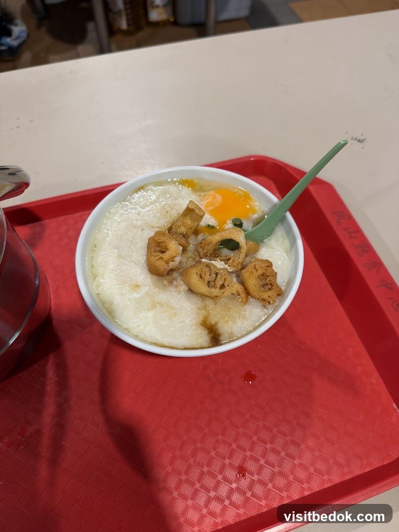 Congee with Egg and Fried Dough Sticks