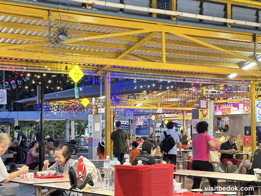 Outdoor Food Court with People Eating