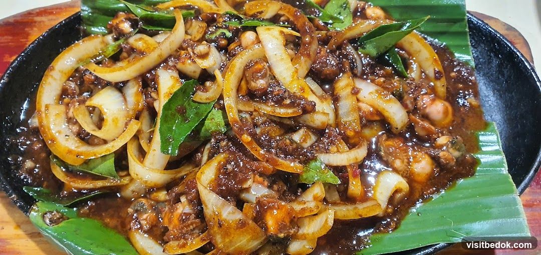 Sizzling Seafood Dish with Onions