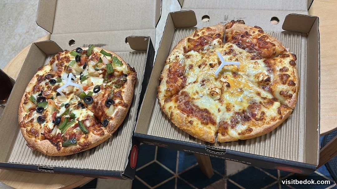 Two pizzas in boxes
