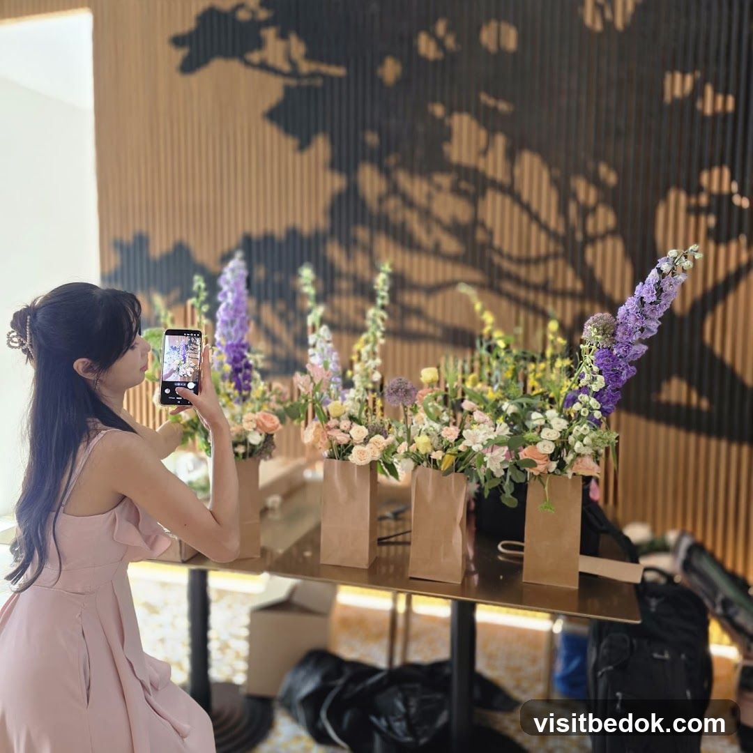 Woman photographing flowers