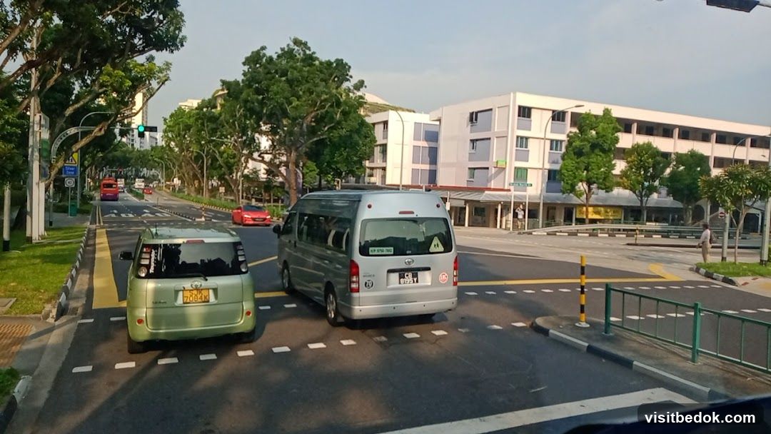 Street scene with vehicles and buildings