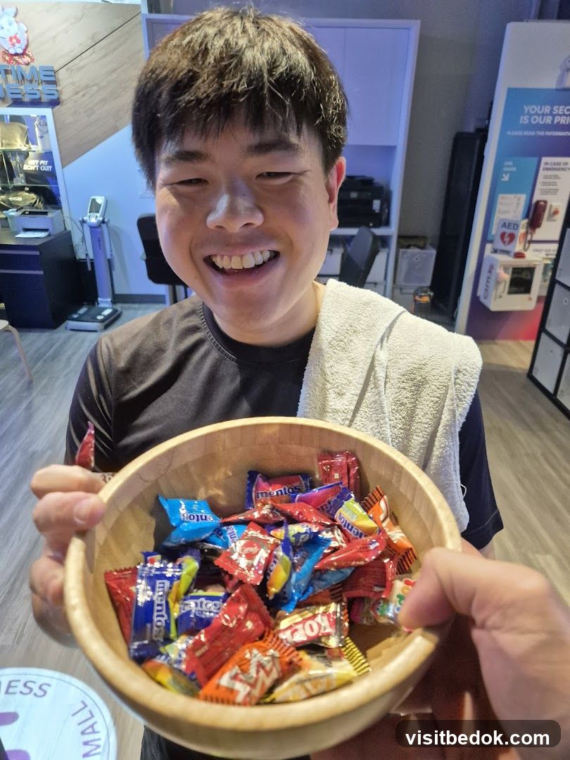 Man holding a bowl of candies