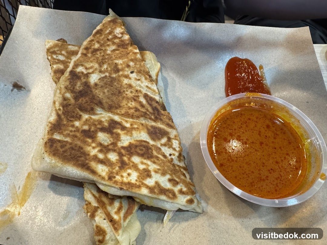 Roti Canai with Curry and Chili Sauce