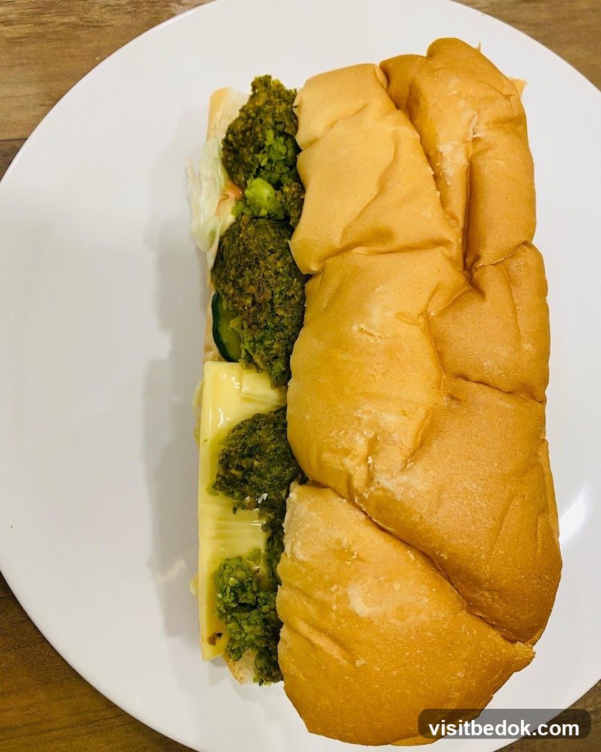 Sandwich with cheese and green spread