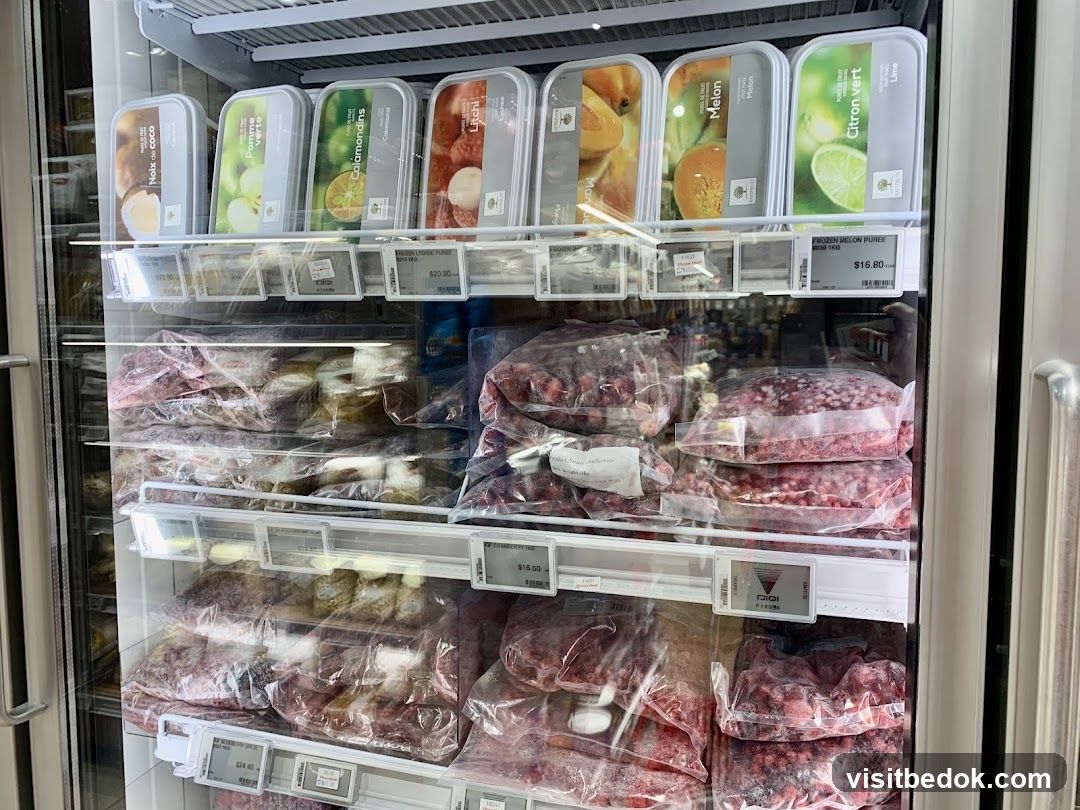 Frozen Fruit Purees and Frozen Berries in a Refrigerator
