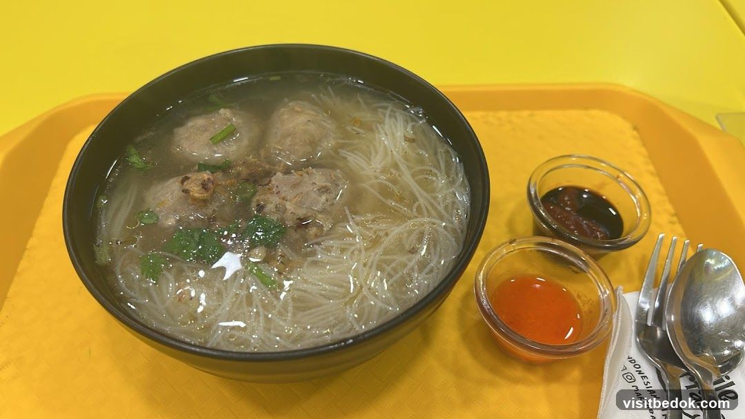 Bowl of Noodle Soup with Meatballs