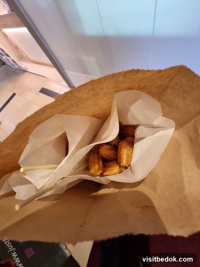 Churros in a paper bag
