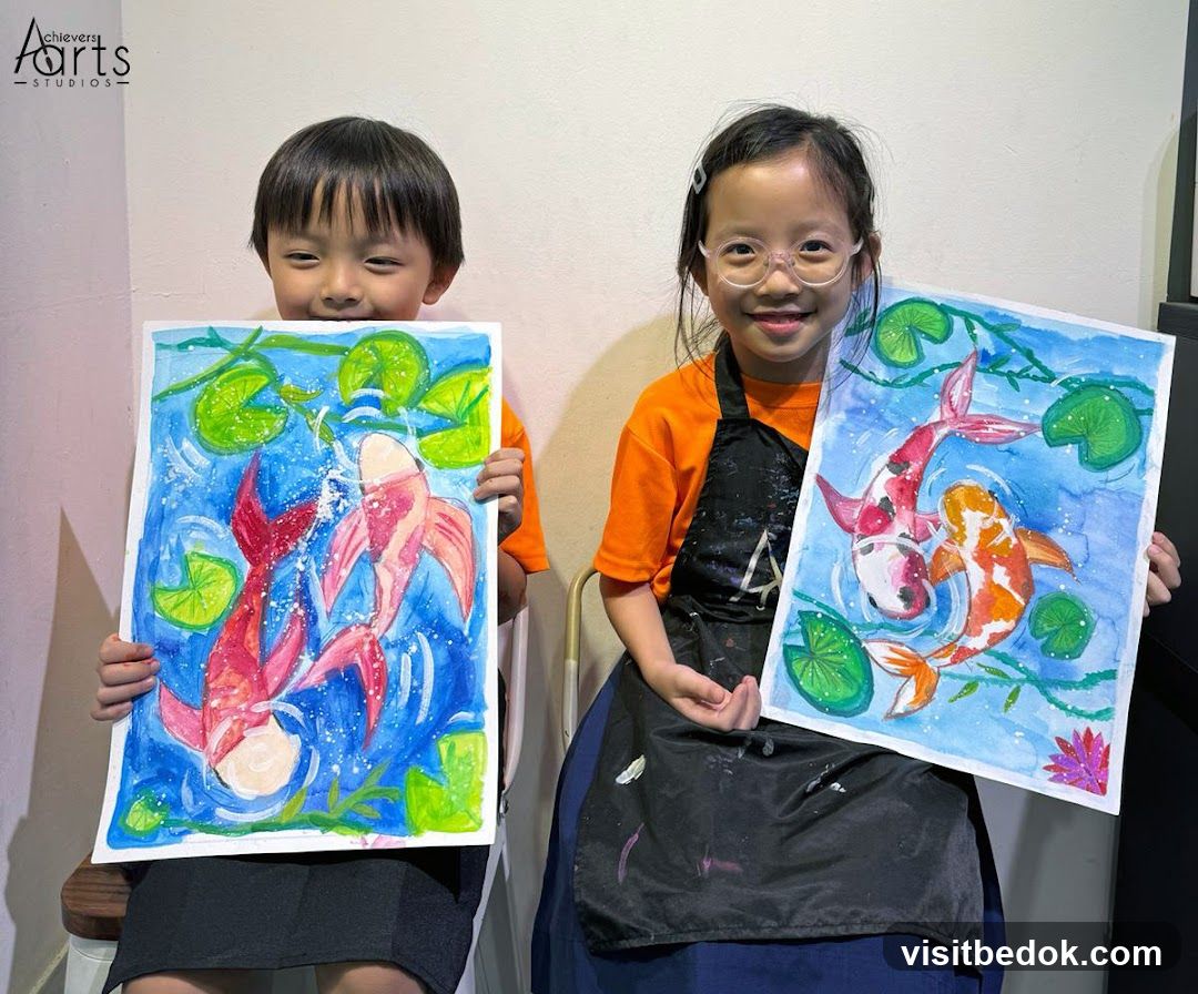 Children proudly displaying koi fish paintings