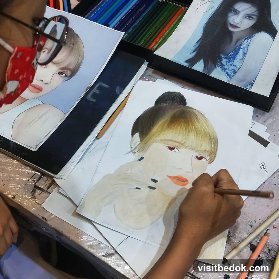 Artist drawing portraits