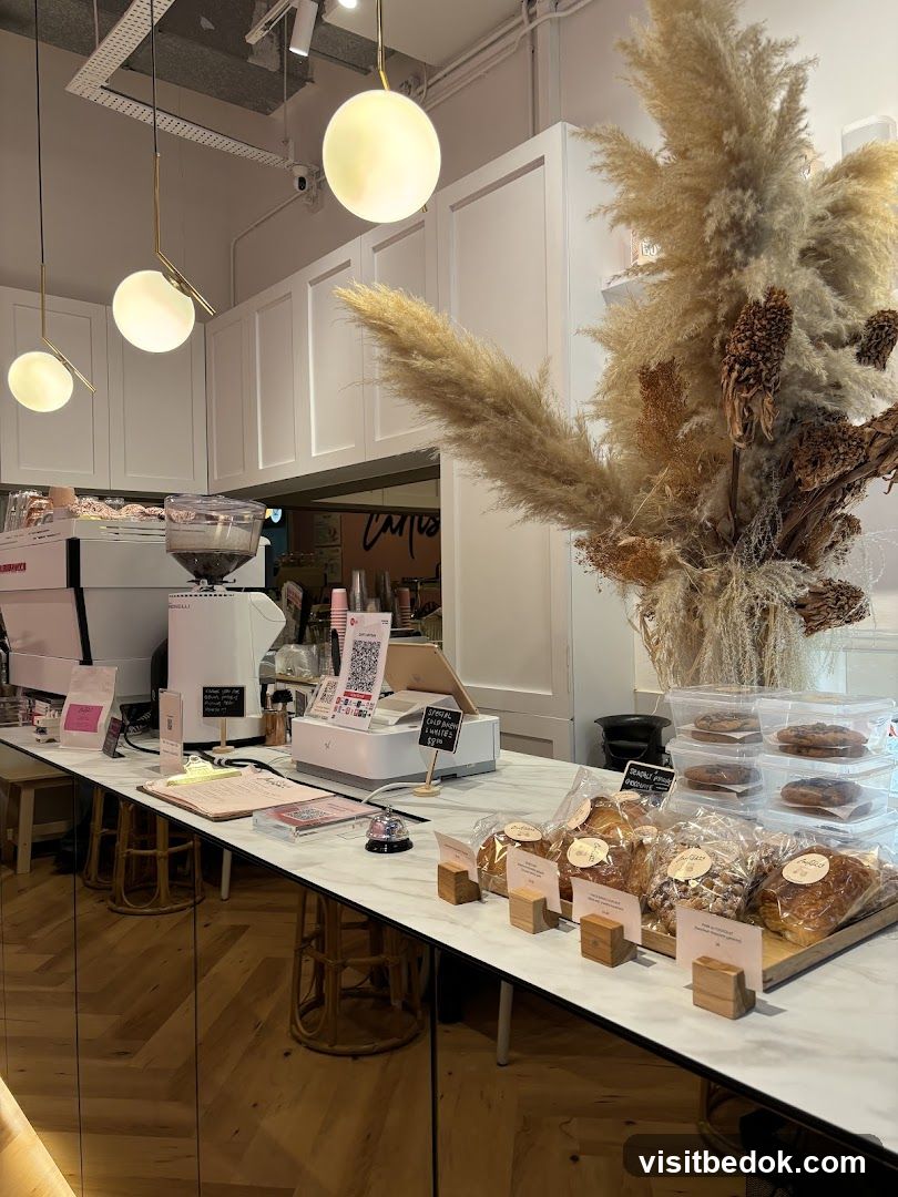 Cafe Counter with Pastries and Coffee Machine
