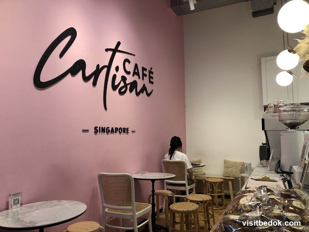 Cafe Interior with Pink Walls and Seating