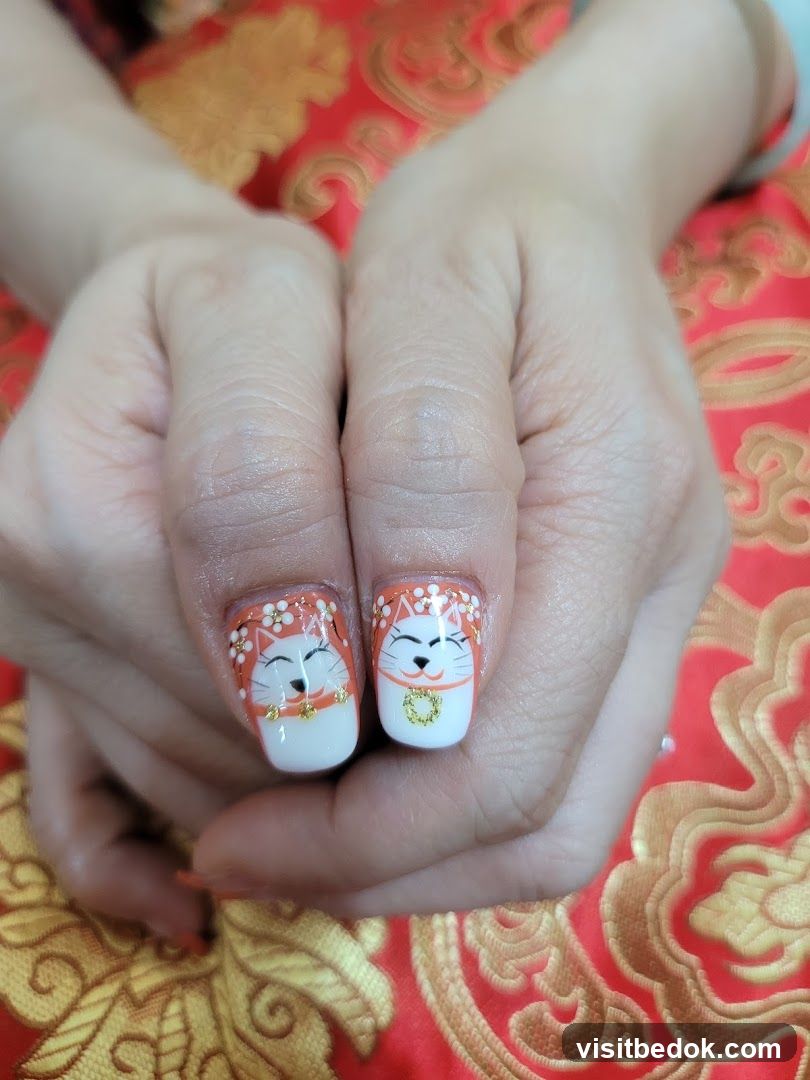 Manicured Nails with Cat Design