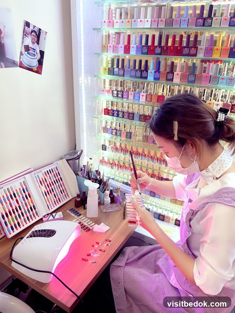 Nail Technician Applying Gel Polish