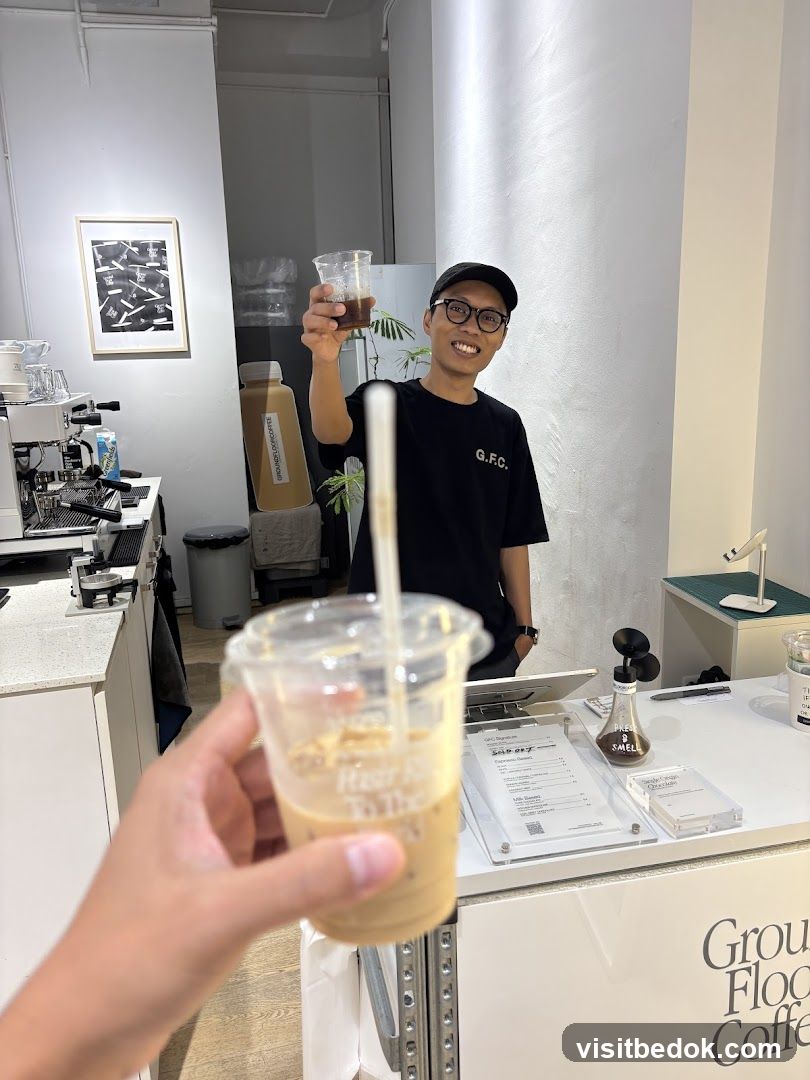 Barista holding a drink