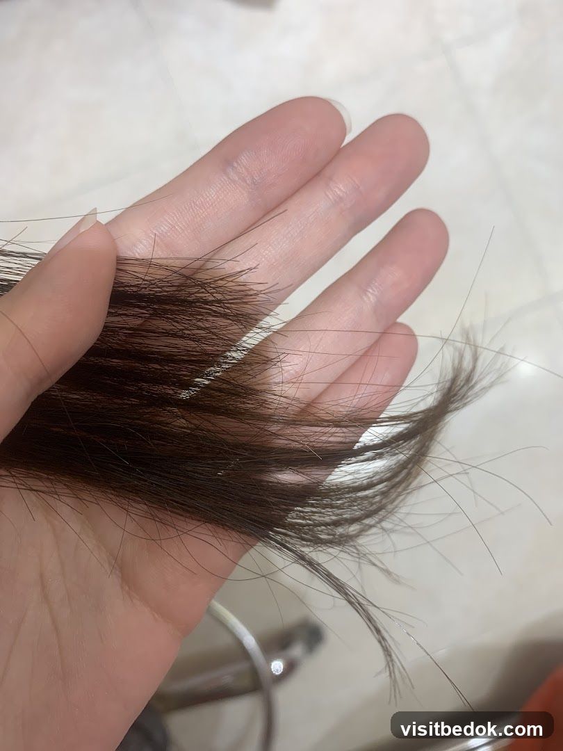 Hand holding hair
