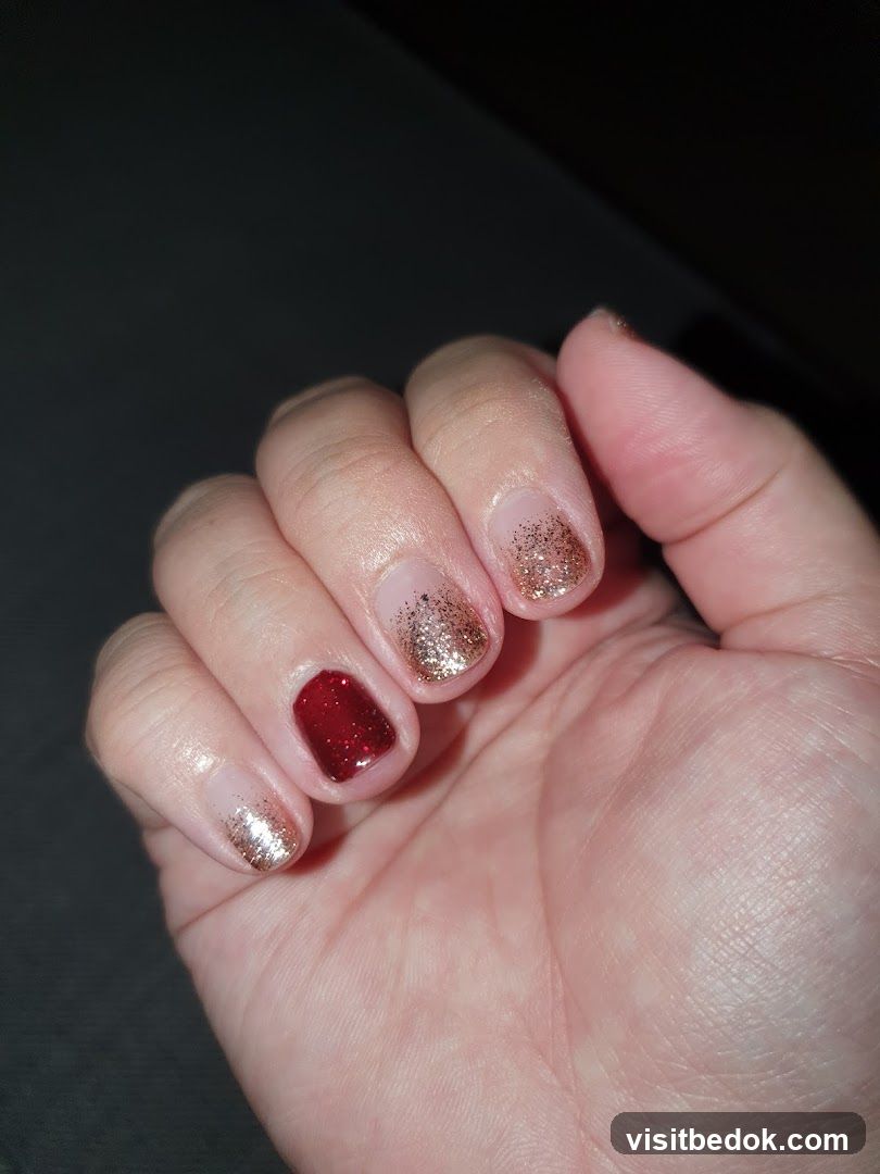 Nails with Glitter and Red Polish