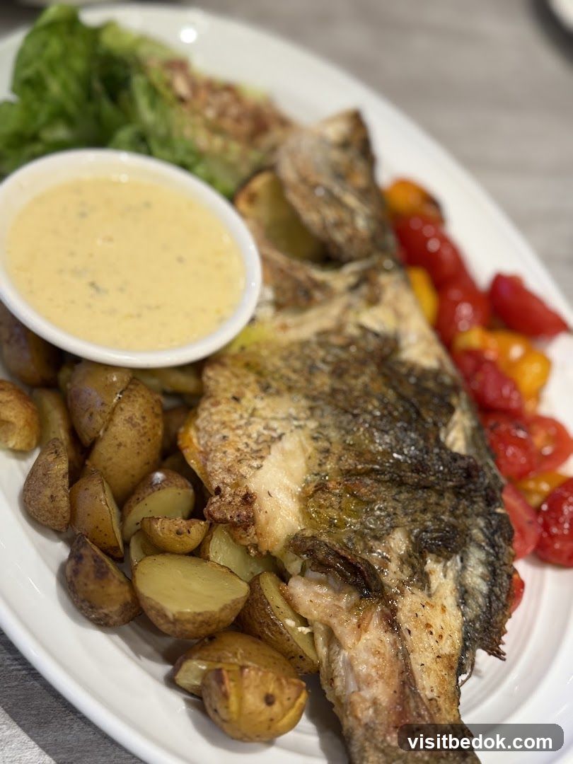 Whole Roasted Fish with Potatoes and Tomatoes