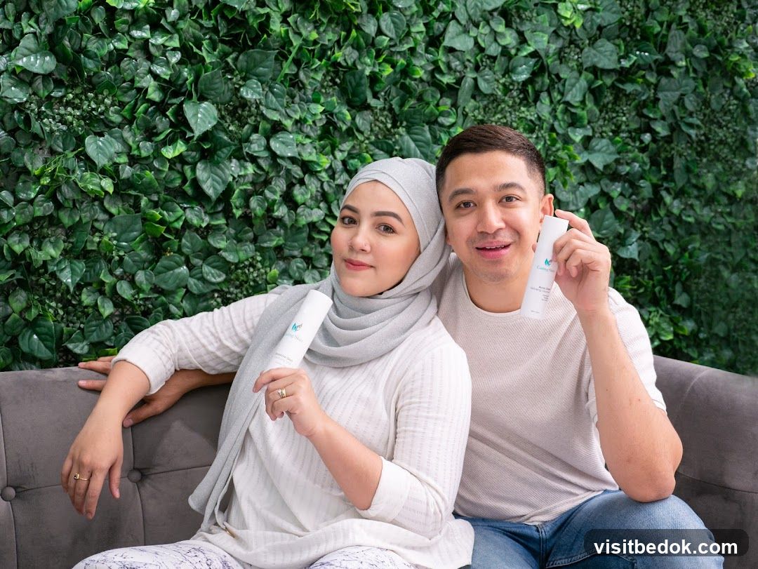 Couple holding skincare products