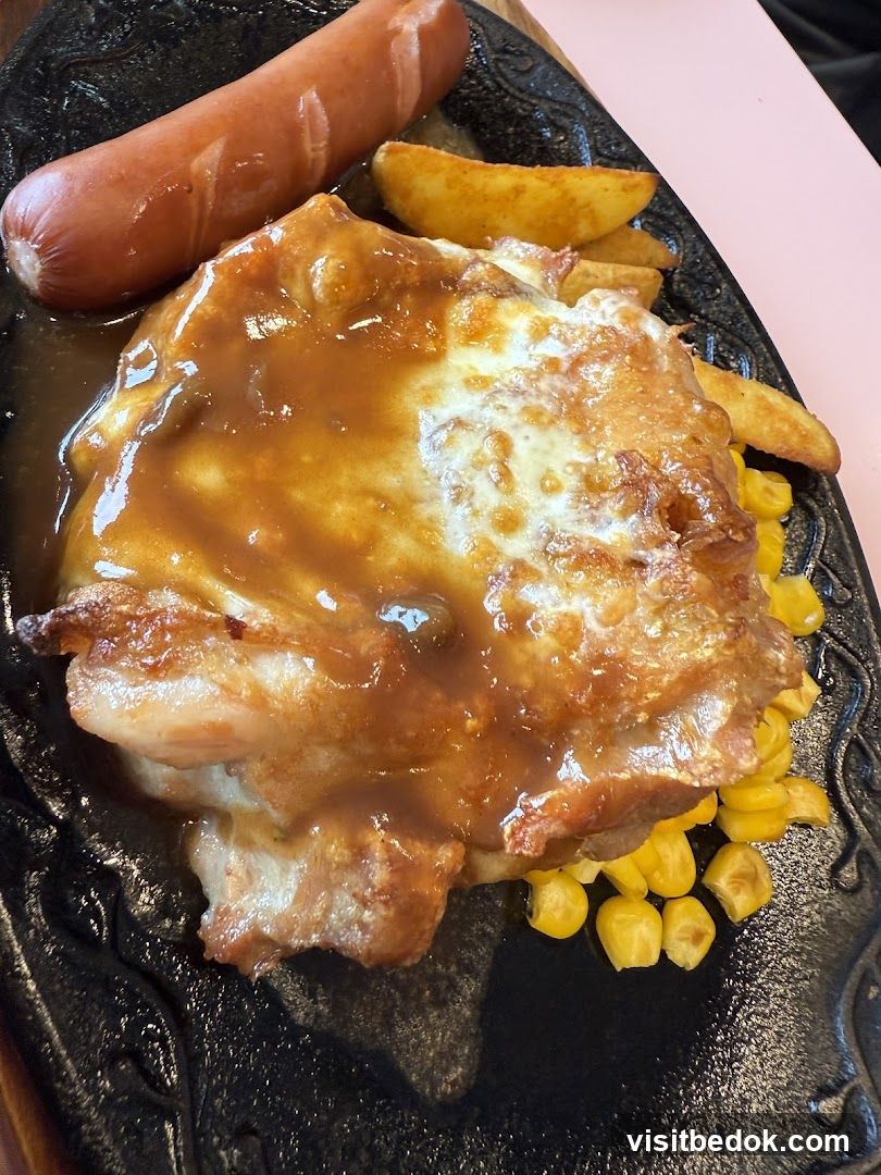 Sizzling Chicken Steak with Sausage and Fries