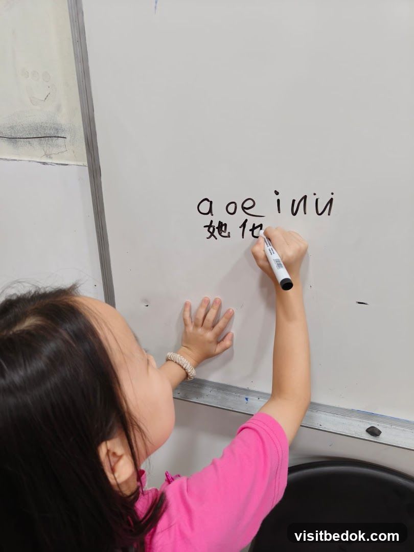 Child writing on whiteboard