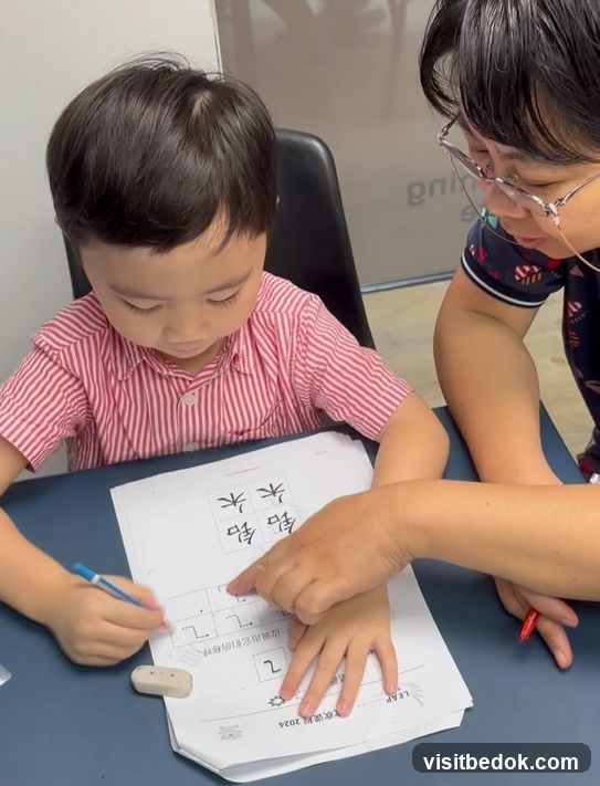 Child learning to write Chinese characters