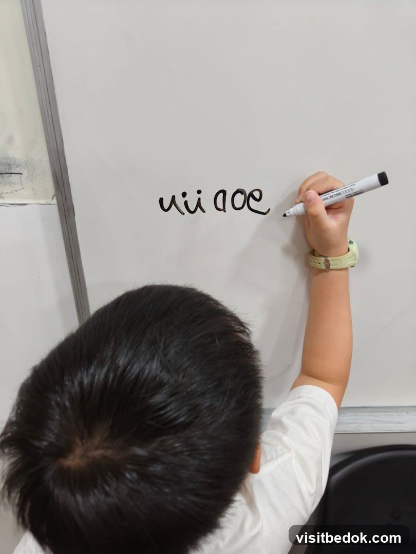 Child writing on whiteboard