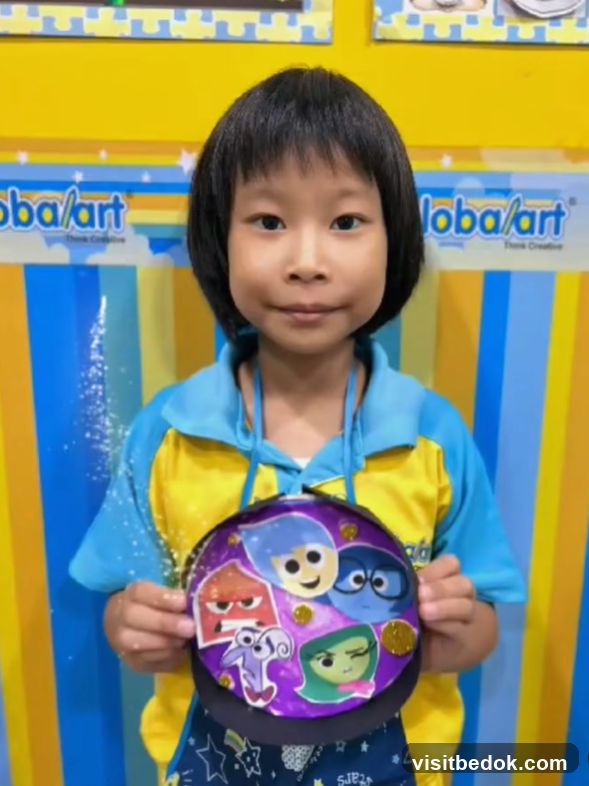 Child Holding Artwork