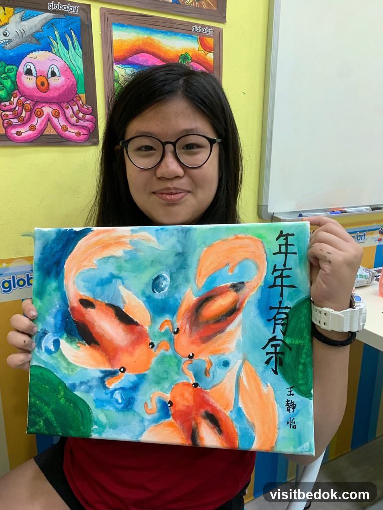Girl holding a painting of koi fish