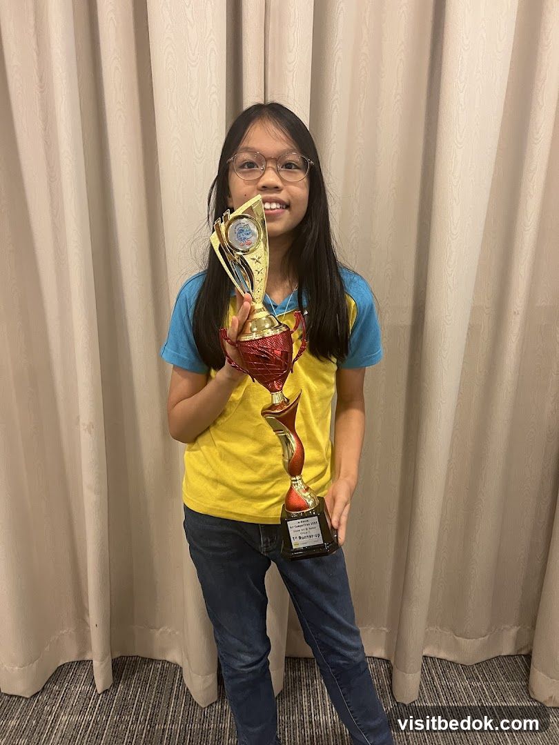Girl holding trophies