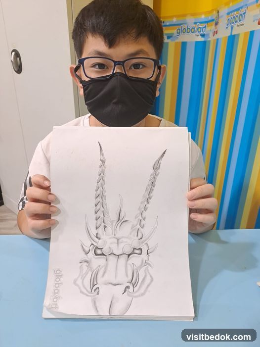 Young artist holding drawing