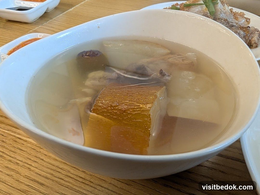 Bowl of soup with meat and vegetables