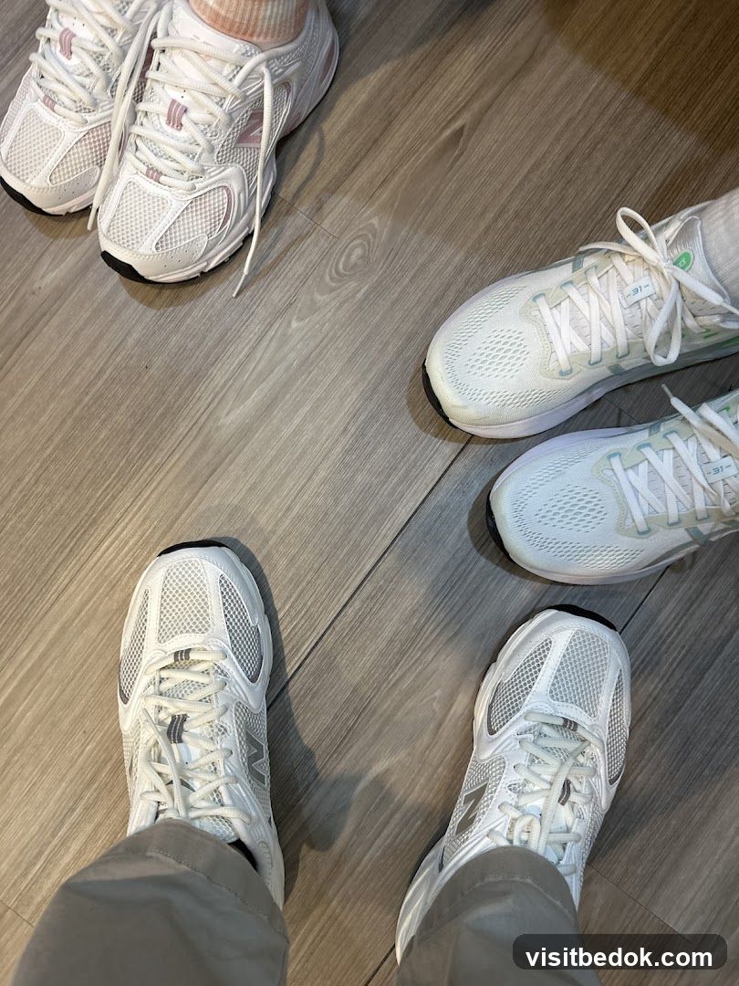 Multiple Pairs of White Sneakers