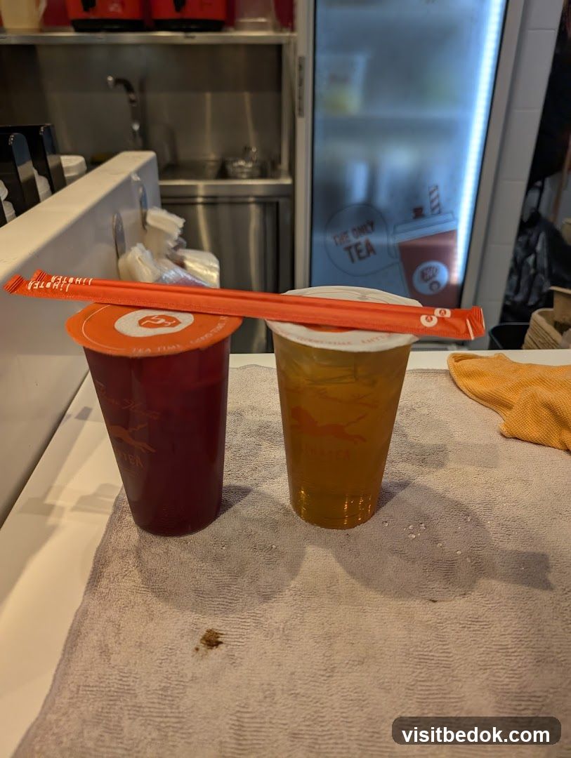 Two drinks with straws