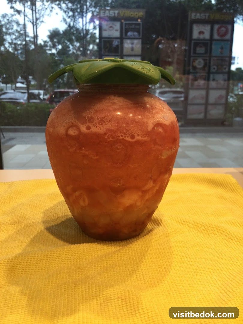 Strawberry-shaped pitcher with drink